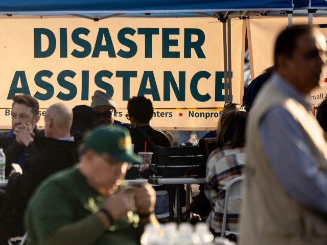 People impacted by the wildfires seek information and relief at a FEMA Disaster Recovery Center at Pasadena City College Thursday, Jan. 16, 2025, in Pasadena, Calif. (AP Photo/Etienne Laurent)