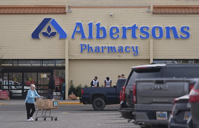 FILE - Shoppers head into an Albertson's grocery store Saturday, Nov. 23, 2024, in Cheyenne, Wyo. (AP Photo/David Zalubowski, File)