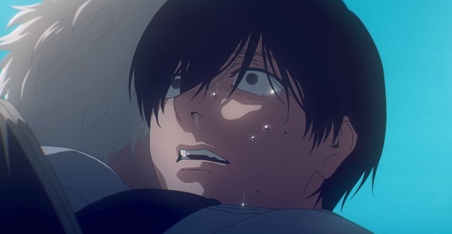 A black-haired anime teenager crying while being hugged by another teenager with white hair in The Summer Hikaru Died.
