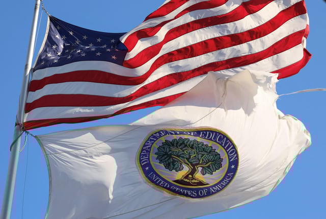 An American flag and a tattered U.S. Department of Education flag fly outside the federal office building, amid reports that U.S. President Donald Trump's administration will take steps to defund the federal Education Department, in Washington, U.S., February 4, 2025. REUTERS/Kevin Lamarque