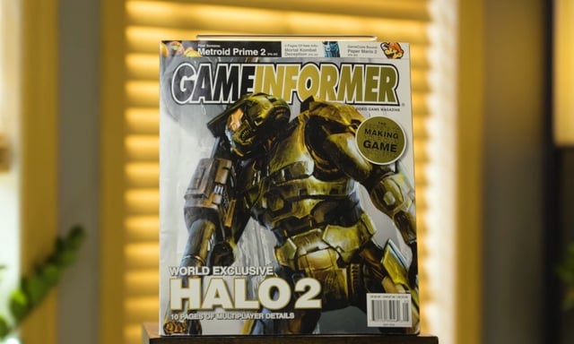 A still from a video announcement of Game Informer's return, featuring the magazine's Halo 2 issue.