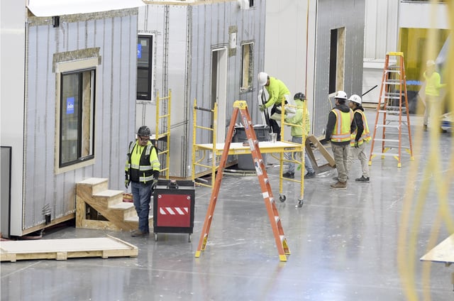 Workers construct modular homes at the Fading West factory in Buena Vista, Colo., on Feb. 19, 2025. ( AP Photo/Thomas Peipert)