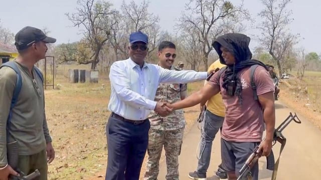 DIG Kamlochan Kashyap (in white) congratulates security personnel on their return after the encounter at Dantewada Bijapur border in Chhattisgarh on Tuesday. (PTI Photo)