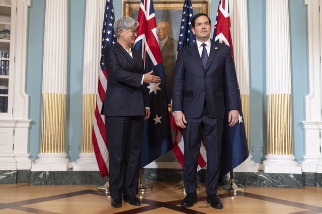 FILE -Australia's Foreign Minister Penny Wong, left, waits to shake hands with Secretary of State Marco Rubio, at the State Department, Jan. 21, 2025, in Washington. (AP Photo/Jacquelyn Martin, File)