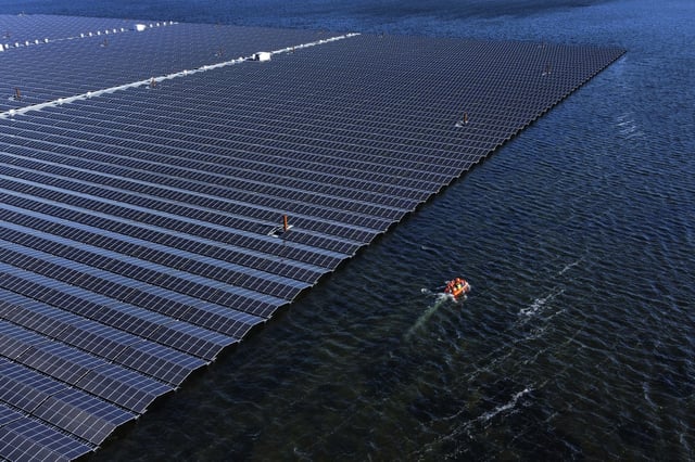 FILE - A floating solar farm operates on the Cottbuser Ostsee lake near Cottbus, Germany, Oct. 16, 2024. (AP Photo/Matthias Schrader, File)