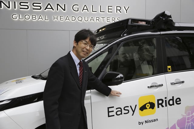 Takeshi Kimura, a Nissan engineer overseeing the Japanese automaker’s self-driving technology, shows the car packed with the technology to reporters at Nissan headquarters in Yokohama, near Tokyo, on March 6, 2025. (AP Photo/Yuri Kageyama)