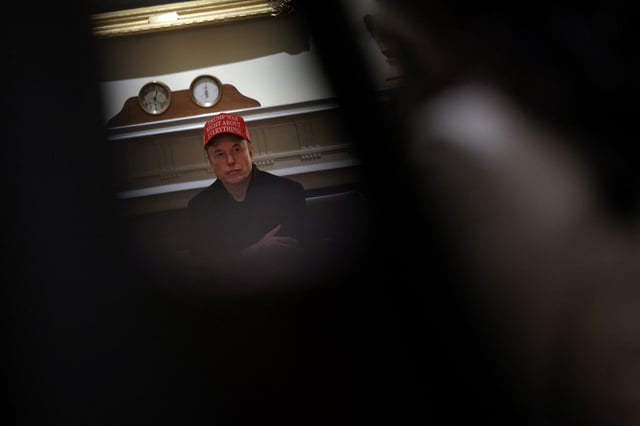 Tesla CEO Elon Musk wears a 'Trump Was Right About Everything!' hat while attending a cabinet meeting at the White House, in Washington, D.C., U.S., March 24, 2025. REUTERS/Carlos Barria/File Photo