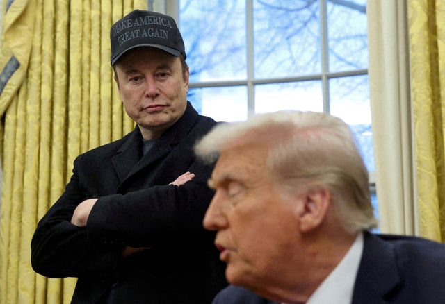 Elon Musk listens to U.S. President Donald Trump speak in the Oval Office of the White House in Washington, D.C., U.S., February 11, 2025.   REUTERS/Kevin Lamarque/File Photo