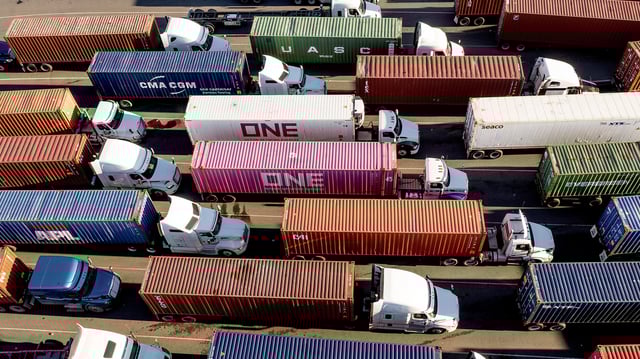 FILE - Trucks line up to enter a Port of Oakland shipping terminal on Nov. 10, 2021, in Oakland, Calif. (AP Photo/Noah Berger, File)