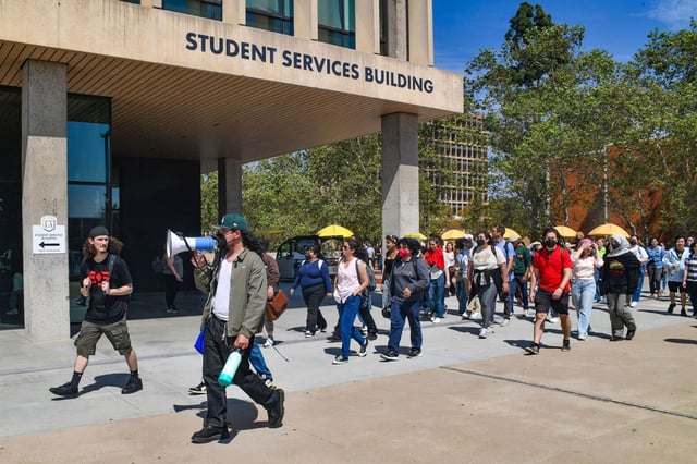 Students and faculty walk to the Student Services Building a they protest the management of the California State University system at Cal State Los Angeles on Tuesday March 25, 2025. (Photo by Keith Durflinger, Contributing Photographer)