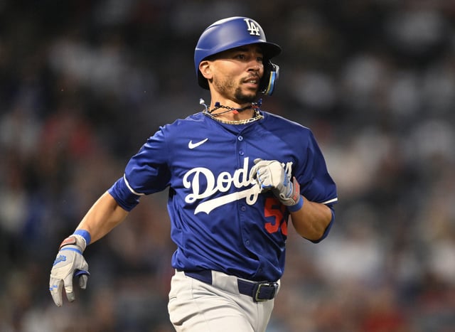 Mookie Betts #50 of the Los Angeles Dodgers grounds out in the sixth inning against the Los Angeles Angels in a spring training game at Angel Stadium of Anaheim on March 25, 2025 in Anaheim, California.