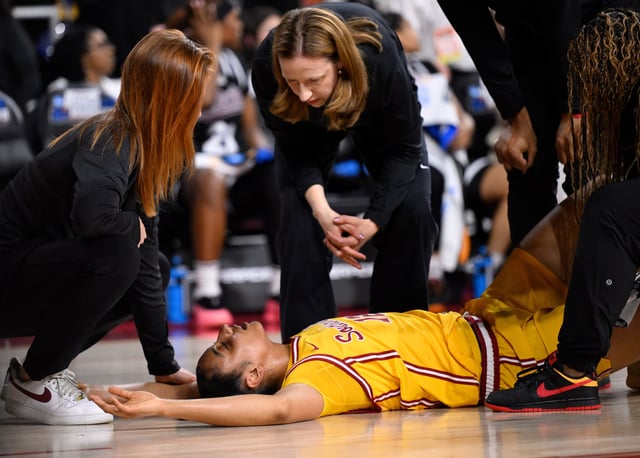 Mar 24, 2025; Los Angeles, California, USA; USC Trojans head coach Lindsay Gottlieb talks to JuJu Watkins after the Trogans guard injured he knee in the first quarter of an NCAA Tournament second round game against the Mississippi State Bulldogs at Galen Center. Mandatory Credit: Robert Hanashiro-Imagn Images/File Photo
