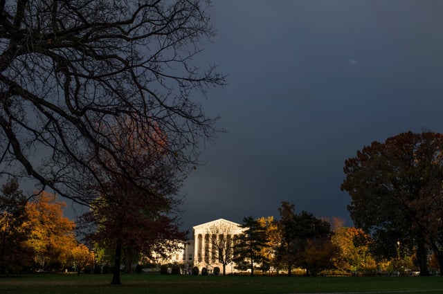 A beam of sunlight breaks through the cloudy skies to illuminate the Supreme Court in Washington.