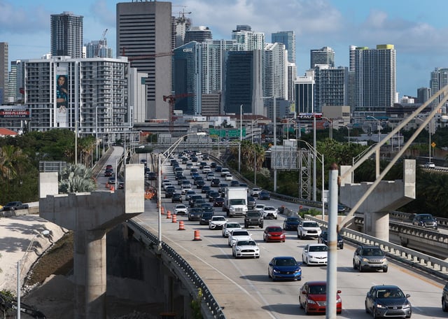 Vehicles drive along I-95 as they leave the downtown area on June 30, 2022 in Miami, Florida.