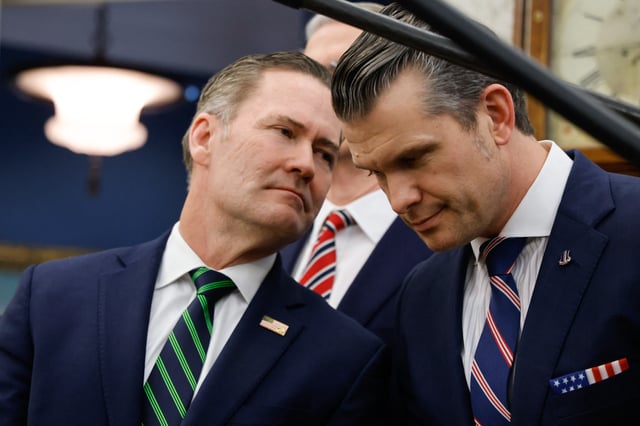 National Security Adviser Mike Waltz speaks with Defense Secretary Pete Hegseth in the Oval Office on February 24, 2025. (Photo by LUDOVIC MARIN/AFP via Getty Images)