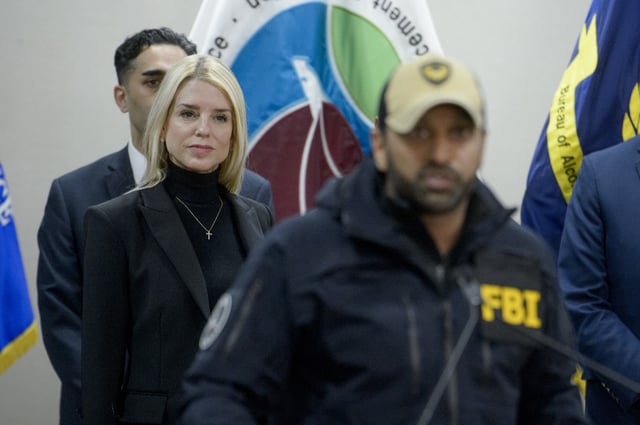 Attorney General Pam Bondi, left, listens as FBI Director Kash Patel speaks about a 24 year-old MS-13 gang leader who was arrested in an operation by the Virginia Homeland Security Task Force in Dale City, VA., on March 27, 2025, during a news conference at the Manassas FBI Field Office, Thursday, March 27, 2025, in Manassas, VA. (AP Photo/Rod Lamkey)