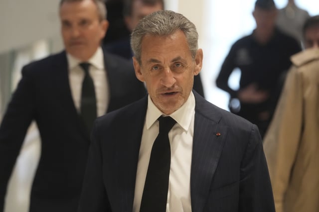 FILE - Former French President Nicolas Sarkozy arrives as he goes on trial over alleged illegal financing of his 2007 presidential campaign by the government of late Libyan leader Moammar Gadhafi, Monday, Jan. 6, 2025 in Paris. (AP Photo/Thibault Camus, File)