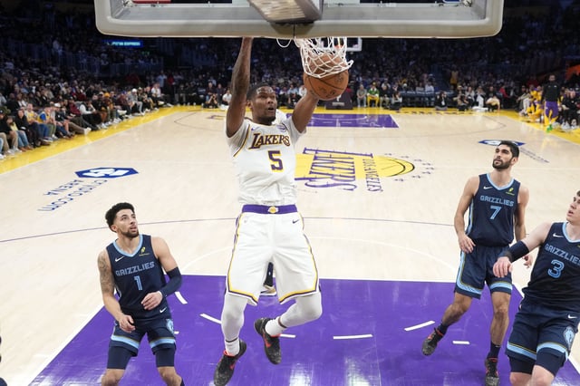 Dec 15, 2024; Los Angeles, California, USA; Los Angeles Lakers forward Cam Reddish (5) dunks the ball in the first half against the Memphis Grizzlies at Crypto.com Arena. Mandatory Credit: Kirby Lee-Imagn Images/File Photo
