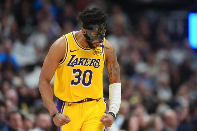 Lakers guard Jordan Goodwin reacts after hitting a 3-point basket in the second half of an NBA basketball game against the Denver Nuggets, Friday, March 14, 2025, in Denver. (AP Photo/David Zalubowski)