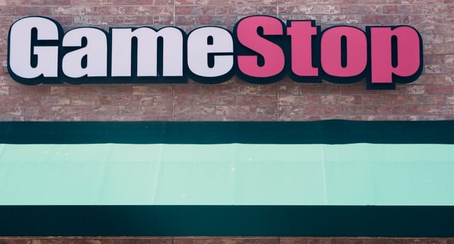 FILE - The sign hangs above the doorway into a GameStop store, June 11, 2024, in Lone Tree, Colo. (AP Photo/David Zalubowski, file)