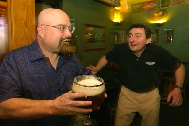 Toronado founder Dave Keene, left, with Denis Dominique, brewmaster at the Abbey of Scourmount in Belgium, at the bar in 2003.
