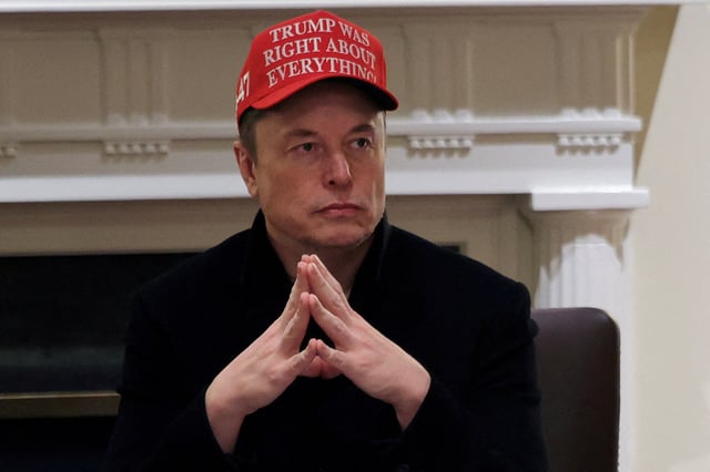 Tesla CEO Elon Musk wears a 'Trump Was Right About Everything!' hat while attending a cabinet meeting at the White House, in Washington, D.C., U.S., March 24, 2025.