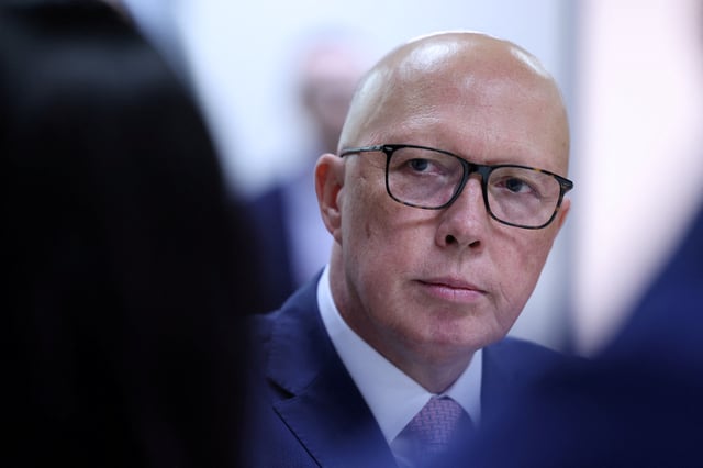 Liberal Party leader Peter Dutton listens during a visit to youth mental health foundation, Headspace, in Parramatta, Western Sydney, Australia, March 23, 2025. REUTERS/Hollie Adams/File Photo/File Photo