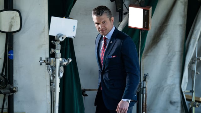 US Defense Secretary Pete Hegseth walks away after being interviewed in front of the White House in Washington, DC, on March 21, 2025. (Photo by Annabelle GORDON / AFP)