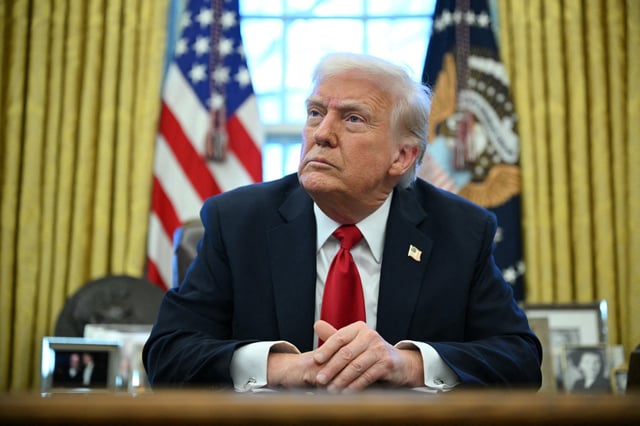 US President Donald Trump announces tariffs on auto imports in the Oval Office of the White House in Washington, DC, on March 26, 2025.