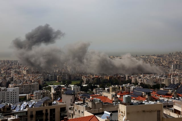 Smoke billows over Beirut's southern suburbs following Israeli strike after issuing an evacuation warning for the area, as seen from Baabda, Lebanon, March 28, 2025. REUTERS/Mohamed Azakir