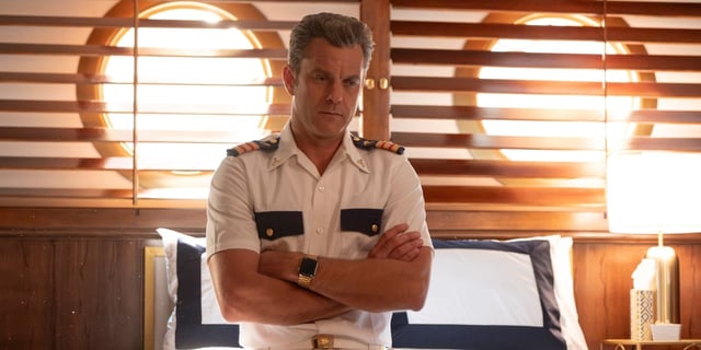 Joshua Jackson standing with his arms crossed in Doctor Odyssey Episode 12