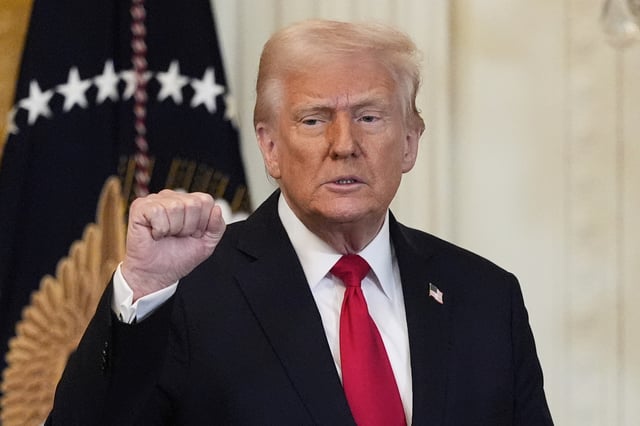 President Donald Trump gestures after speaking at a reception celebrating Women&#39;s History Month in the East Room of the White House, Wednesday, March 26, 2025, in Washington.