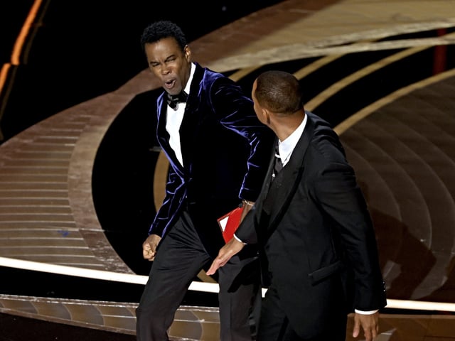 HOLLYWOOD, CALIFORNIA - MARCH 27: Will Smith appears to slap Chris Rock onstage during the 94th Annual Academy Awards at Dolby Theatre on March 27, 2022 in Hollywood, California. (Photo by Neilson Barnard/Getty Images)