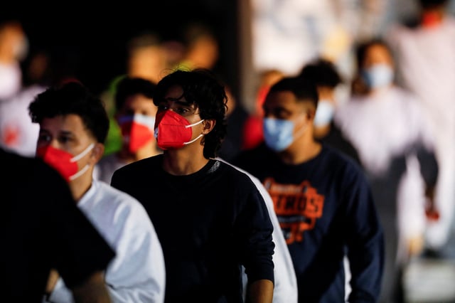 Venezuelan migrants walk following their arrival on a flight after being deported from the United States, in Caracas, Venezuela, March 28, 2025. REUTERS/Leonardo Fernandez Viloria/File Photo