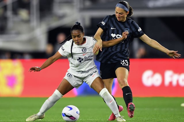 Kiki Pickett, left, of Bay FC and Ashley Hatch of Washington Spirit battle for the ball during the NWSL match between Washington Spirit and Bay FC at Audi Field on March 28, 2025 in Washington, DC. 