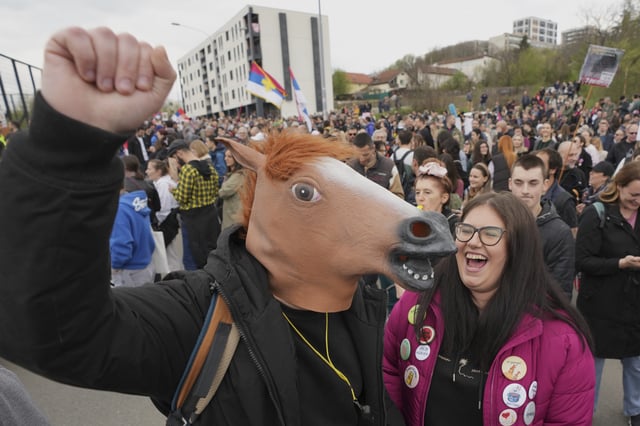 Protesting students rally outside a key pro-government television station, The Informer TV accusing it of spreading hate speech during nearly five months of persistent street demonstrations against corruption in Belgrade, Serbia, Saturday, March 29, 2025. (AP Photo/Darko Vojinovic)