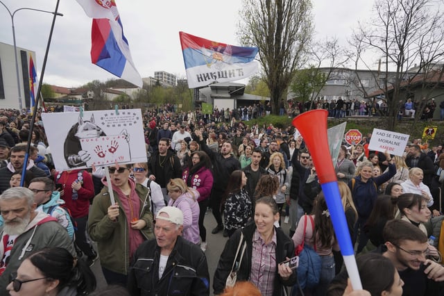 Protesting students rally outside a key pro-government television station, The Informer TV accusing it of spreading hate speech during nearly five months of persistent street demonstrations against corruption in Belgrade, Serbia, Saturday, March 29, 2025. (AP Photo/Darko Vojinovic)