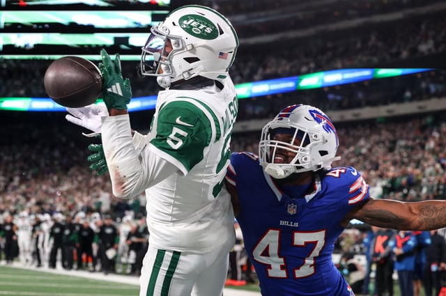 Oct 14, 2024; East Rutherford, New Jersey, USA; Buffalo Bills cornerback Christian Benford (47) knocks the ball away from New York Jets wide receiver Garrett Wilson (5) during the second half at MetLife Stadium. Mandatory Credit: Ed Mulholland-Imagn Images/File Photo
