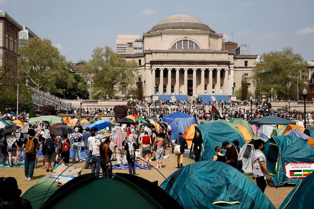 Student protesters gather inside their encampment on the Columbia University campus in April 2024 in New York.