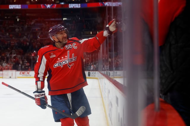 Washington Capitals left wing Alex Ovechkin (8) celebrates with his son Sergei (not pictured) after a win at Capital One Arena.