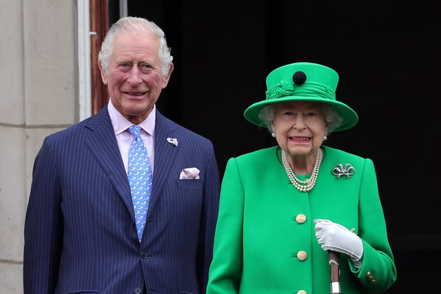 Queen Elizabeth II and Prince Charles, Prince of Wales on the balcony of Buckingham Palace during the Platinum Jubilee Pageant on June 05, 2022 in London, England.