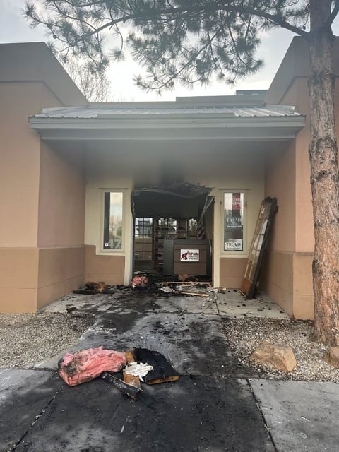 This photo provided by the Republican Party of New Mexico shows damage to the entry of the group's headquarters in Albuquerque on Sunday, March 30, 2025.