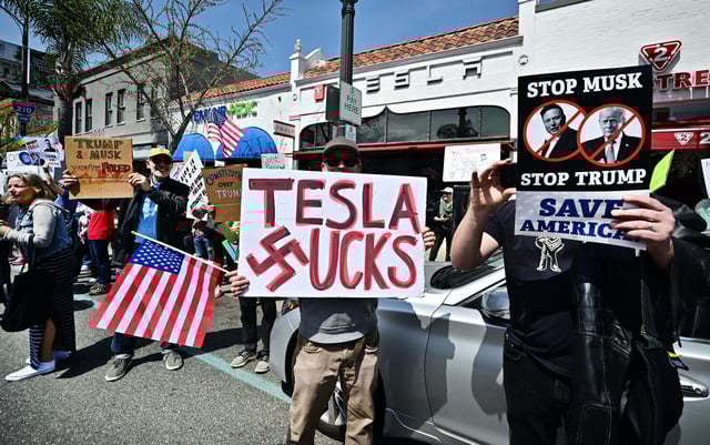 Demonstrators rally against Tesla CEO Elon Musk during a &#34;Tesla Takedown&#34; protest outside a Tesla Store in Pasadena, California, on March 29, 2025.