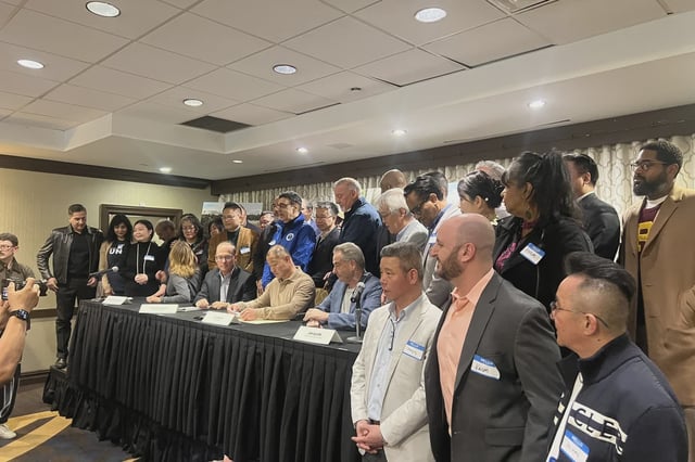 State Sen. John Liu, center, addresses media on Sunday, March 30, 2025.