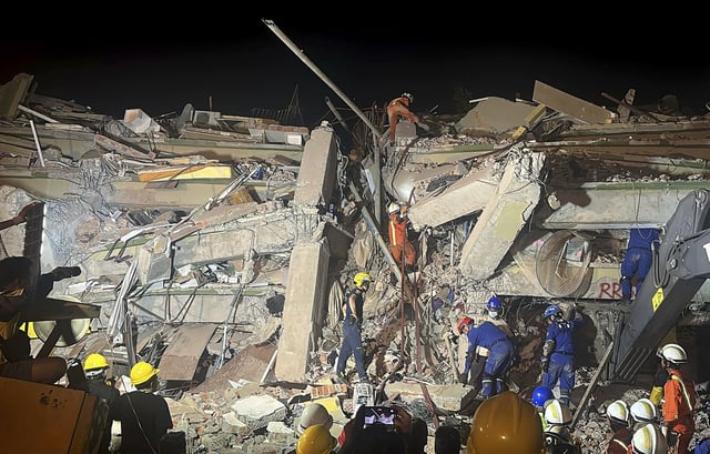 Rescuers work at the site of the Sky Villa Condo that collapsed In Friday's earthquake in Mandalay, Myanmar, Sunday, March 30, 2025. (AP Photo/Thein Zaw)