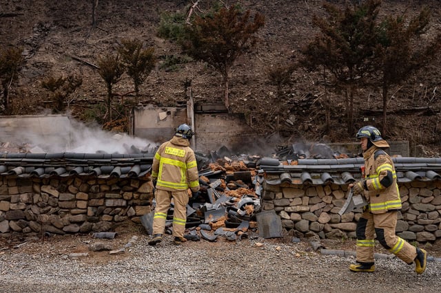Buildings, including Gounru Pavilion at Gounsa Temple in Danchon-myeon, Uiseong County, North Gyeongsang Province, stand in ruins after being completely destroyed by a wildfire in South Korea on March 28, 2025.