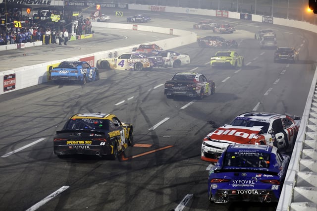 Taylor Gray, driver of the #54 Operation 300 Toyota, and Sammy Smith, driver of the #8 Pilot Chevrolet, after an on-track incident to end the NASCAR Xfinity Series US Marine Corps 250 at Martinsville Speedway on March 29, 2025 in Martinsville, Virginia.