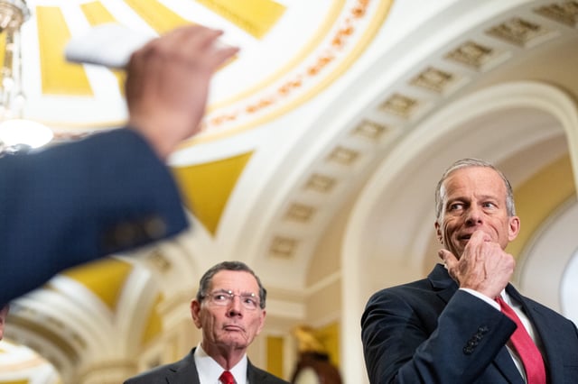 Senate Majority Leader John Thune, R-S.D., right, takes questions at a news conference in the Capitol on Feb. 19 as Sen. John Barrasso, R-Wyo., looks on.