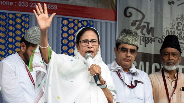 West Bengal chief ninister Mamata Banerjee addresses a gathering on the occasion of Eid-ul-Fitr festival at Red Road in Kolkata on Monday. 