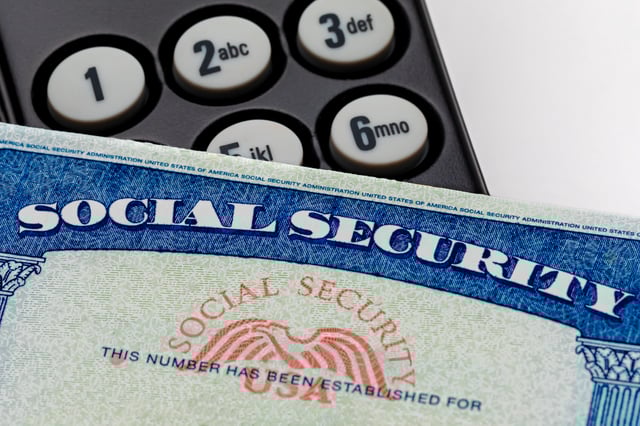 Stock image/file photo: A Social Security card with a phone.